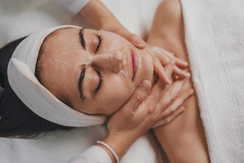 Medspa treatment session applying chemical peels to the face.
