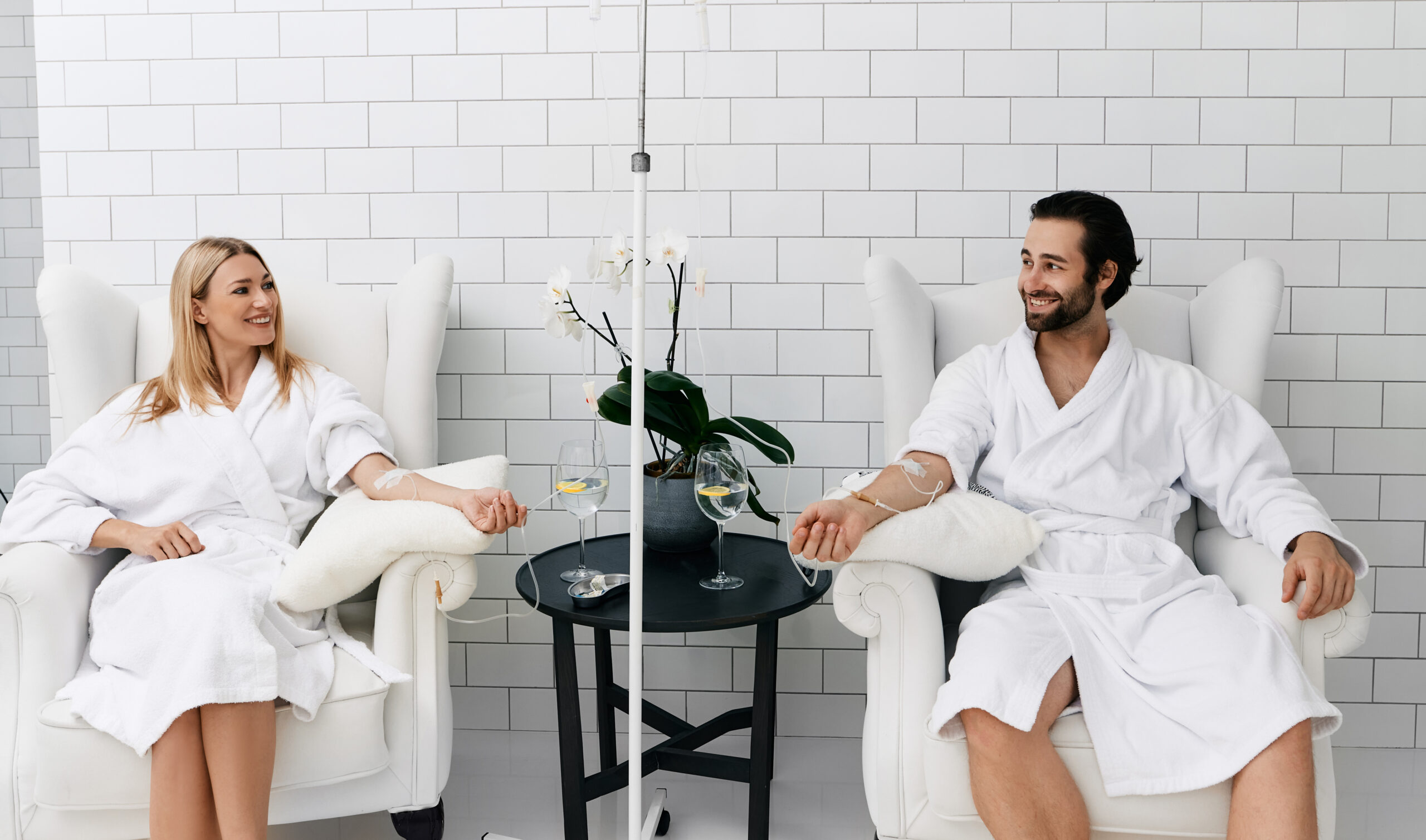 Clients receiving IV hydration therapy in a comfortable wellness setting for hydration, recovery, and rejuvenation.